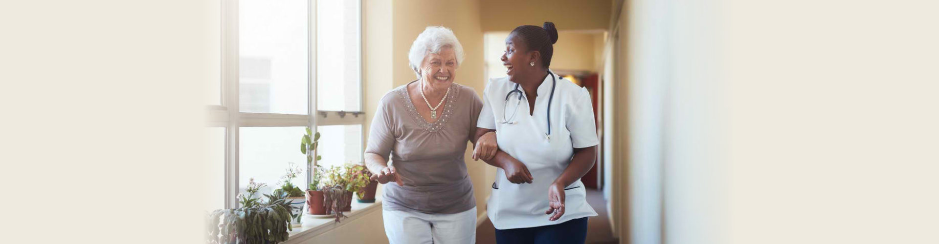 senior and caregiver woman laughing