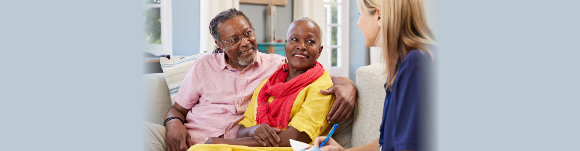 senior couple talking to a woman